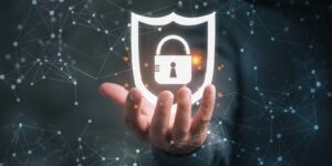 Hand holding cybersecurity virtual lock