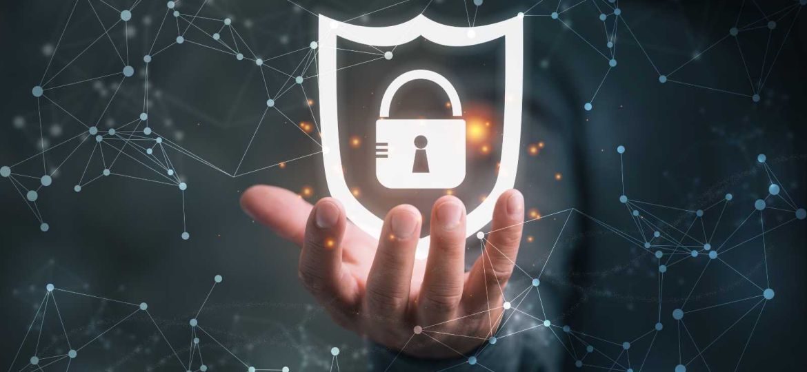 Hand holding cybersecurity virtual lock